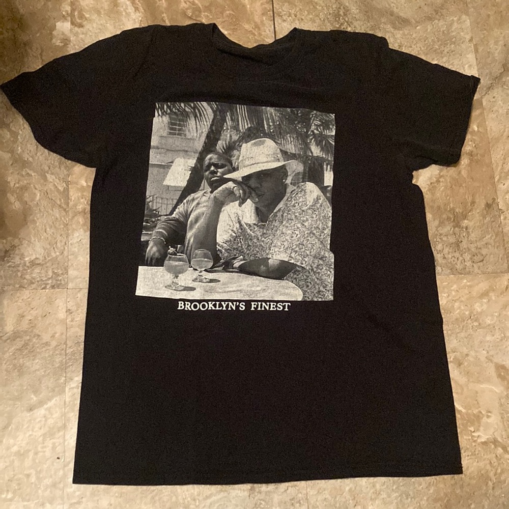 Black tee with design on it